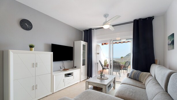 A living room with a sofa, a coffee table, a TV, and a cabinet. - Vacation Apartment 'Isabel Vista Sur' with Sea View, Shared Pool and Wi-Fi (Chayofa)