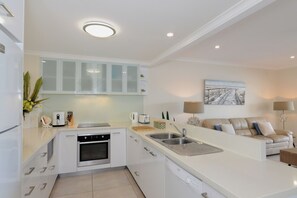 Fridge, microwave, oven, stovetop - Unit 24 - Three Bedroom Waterfront Deluxe (Noosa)
