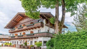 A traditional Alpine-style building with multiple balconies and a sign reading "Pension Blaiken." - Rustic Tyrolean guesthouse, only 300m from the ski lift (Scheffau am Wilden Kaiser)