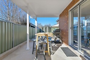 Outdoor dining - Cosy on Curran | CBD Escape, EV Plug, Firepit (Orange)
