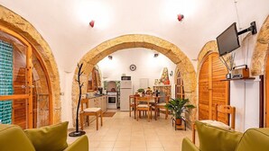 A cozy interior with a dining area, kitchen, and seating space. - Trullo Resia: A cozy and welcoming trullo in the characteristic style of the Apulian countryside, with Free WI-FI. (Ostuni)