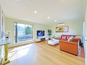 Comfort House | Living area | 65-inch TV with cable channels - Ringwood 2BR Home (Ringwood)