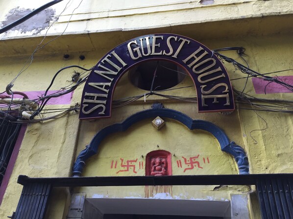 A building with a sign reading "SHANTI GUEST HOUSE" above the entrance.