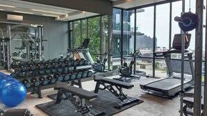 A gym with weightlifting equipment, treadmills, and exercise balls. - B303- 1 Bedroom Condo With Sea View, Ao Nang Beach (Krabi)