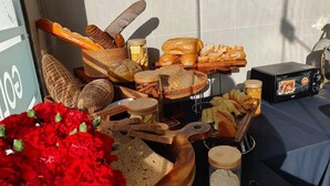 A breakfast buffet with various breads, pastries, and a toaster. - The Gold Coast Hotel Nha Trang (Nha Trang)