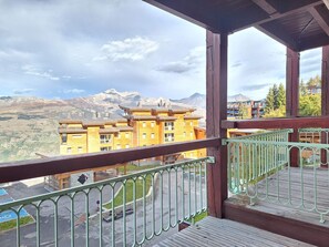 Enjoy breathtaking views of the surrounding mountains from this balcony.
