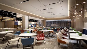 A modern restaurant with multiple dining areas, including a bar and a seating area with tables and chairs. - Holiday Inn Express Suzhou Bay (Suzhou)