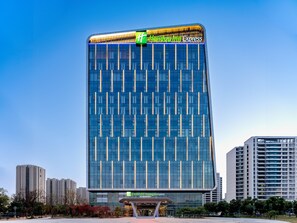A modern hotel building with a glass facade and a prominent 'Holiday Inn Express' sign. - Holiday Inn Express Suzhou Bay (Suzhou)