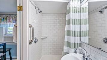 Bathtub, hair dryer, towels