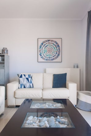 Comfort Villa, Pool Access, Sea View | Living area | 42-inch Smart TV with cable channels, fireplace