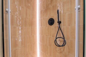 Shower, hair dryer, towels, soap