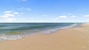A beach with clear skies and calm waters. - Windward Pointe 201 by Liquid Life (Orange Beach)