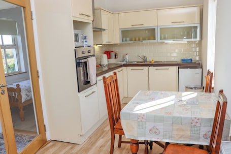 Fridge, electric kettle, toaster, cookware/dishes/utensils