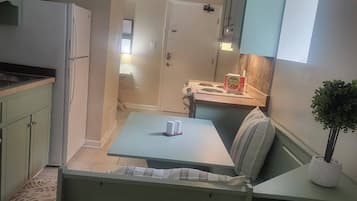 Fridge, stovetop, cookware/dishes/utensils, dining tables