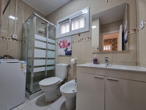 Shower, hair dryer, towels, soap