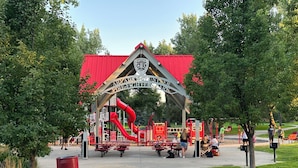 A playground with a red slide and a covered play area. - Large home inArvada, centrally located, 20min to downtown, garage parking, 420ok (Arvada)