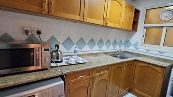 Mini-fridge, microwave, oven, stovetop