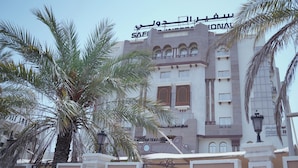 A building with a large sign reading "SAFARI INTERNATIONAL CORNER". - Safeer International Hotel (Muscat)