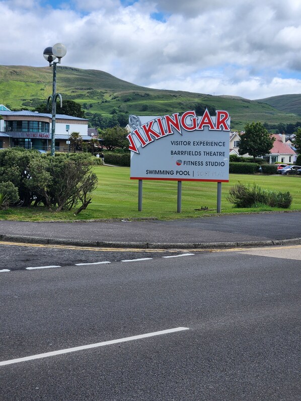 A sign for Vikingar Visitor Experience with amenities like a swimming pool, Barrfields Theatre, and Fitness Studio. - Apartment - Largs - Sleeps 4 - Pet Friendly (Largs)