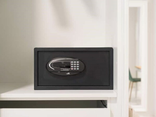 A black electronic device on a white shelf.