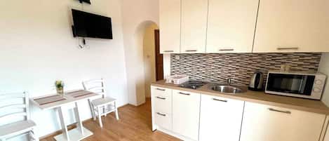 Fridge, stovetop, cookware/dishes/utensils