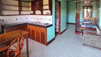 Triple Room | Private kitchenette | Mini-fridge, dining tables