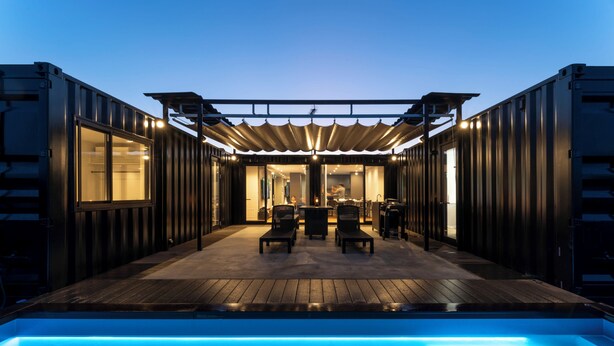 A poolside area with a pergola, seating, and a view into the interior. - RIVIERA Kujukuri (Kujukuri)