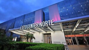 The exterior of Expo Center Norte with a modern glass facade and a prominent entrance. -  Sétimo Hostel 7 (São Paulo)