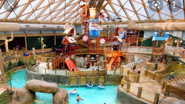 An indoor water park with multiple pools, slides, and water play areas. - Cozy Fall retreat in Massanutten Four Season Mountain Resort ski, bike, fish (McGaheysville)