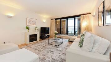 Design Apartment | Living area | 50-inch Smart TV with satellite channels, Netflix, Hulu