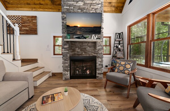 Smart TV, fireplace, books, offices