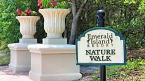 A sign for Emerald Island Resort's Nature Walk. - Charming 3BR Townhome in Kissimmee, perfect for family getaways! (Kissimmee)