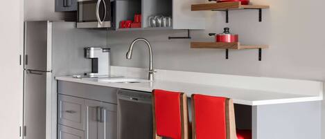 Full-sized fridge, microwave, stovetop, dishwasher