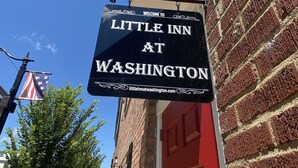 A sign for 'Little Inn at Washington' with a website address. - Little Inn on Main 214 West Main Street (Washington)