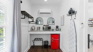 A compact kitchen with a microwave, coffee maker, and a red refrigerator. - Little Inn on Main 214 West Main Street (Washington)
