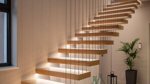 A modern staircase with wooden steps and integrated lighting. - Lovely home in Benkovac with sauna (Benkovac)