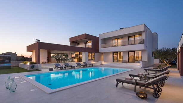 A modern two-story house with a swimming pool, outdoor seating, and a well-lit patio area. - Lovely home in Benkovac with sauna (Benkovac)