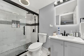 Shower, hair dryer, towels, soap