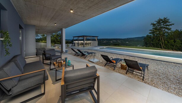 A modern outdoor patio with seating, a pool, and a view of the landscape. - 3 bedroom awesome home in Labin (Labin)