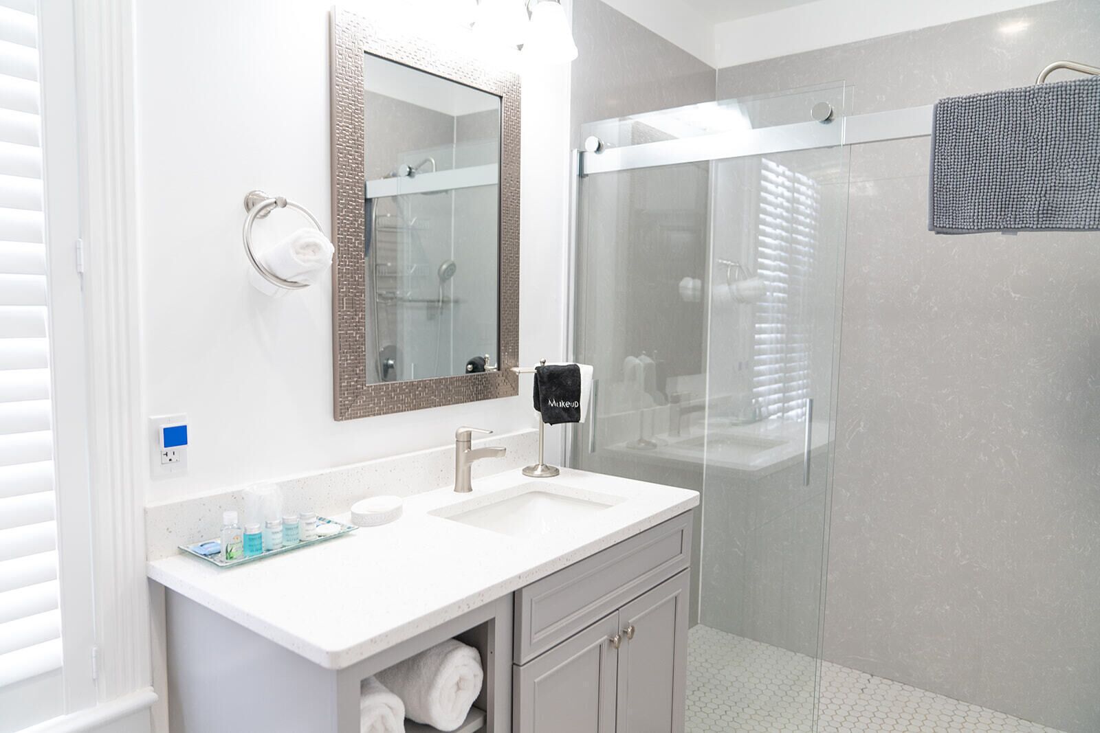 Shower, hair dryer, towels, shampoo
