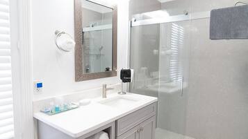 Shower, hair dryer, towels, shampoo