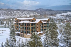 Experience the serene beauty of nature from the comfort of this lodge, surrounded by dense forests and offering breathtaking views.