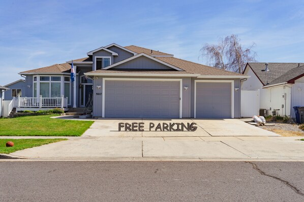 A residential house with a garage and a driveway.