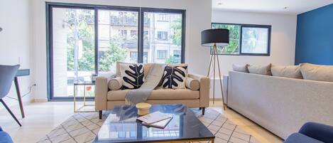 Exclusive Apartment | Living area | 75-inch Smart TV with digital channels, smart speakers