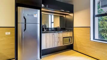 Apartment | Private kitchen | Full-sized fridge, microwave, cookware/dishes/utensils