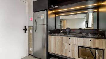 Full-size fridge, microwave, cookware/dishes/utensils