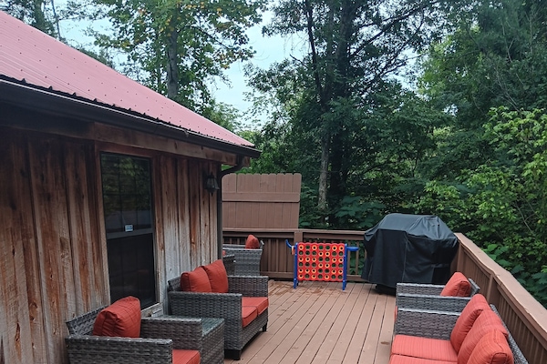 Large back deck with grill and hot tub