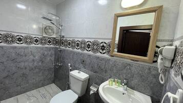 Hair dryer, bidet, towels, soap