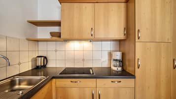 Fridge, stovetop, dishwasher, coffee/tea maker