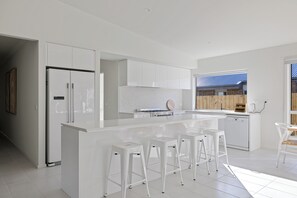 Enjoy cooking in this well-equipped kitchen with a central island and oven.